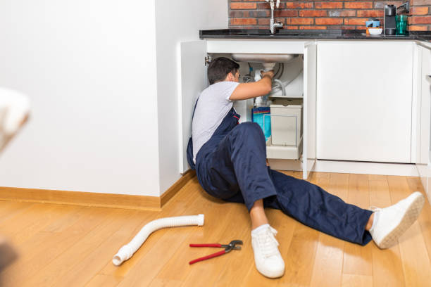 istock Plumber fixing under the sink in the kitchen 1280018376