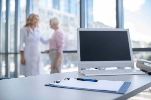 istock Doctor putting her hand on patients shoulder showing support and concern 1280022506