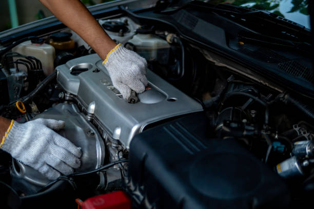 istock Auto mechanic working in garage. Repair service. 1280022924