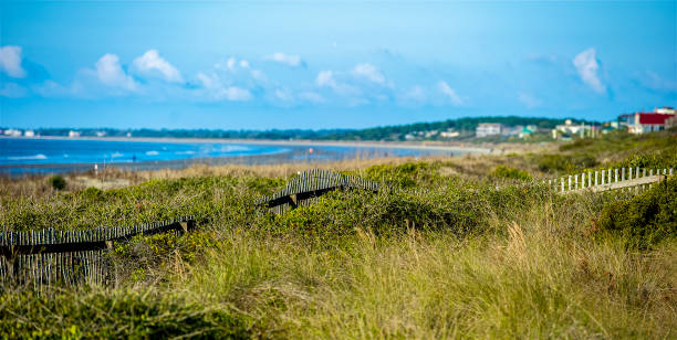 Kiawah Island, Georgia Kiawah Island is a barrier island along the east coast of the US located about 25 miles southwest of Charleston, SC. Names for the Kiawah Indians, it is now primarily a golf and beach resort community. kiawah island stock pictures, royalty-free photos & images