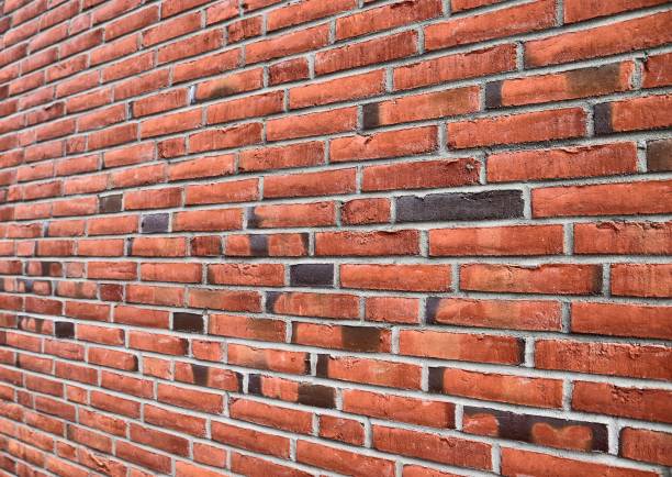 istock Old brick wall. Texture of old weathered brick wall panoramic background 1280026297