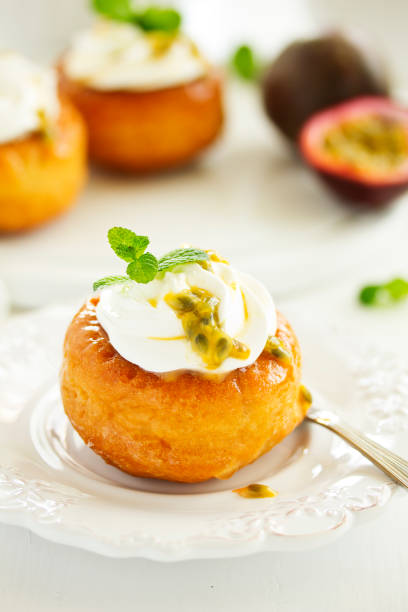 istock Rum woman (brioche) with cream and passion fruit. Dessert. Selective focus 1280027221