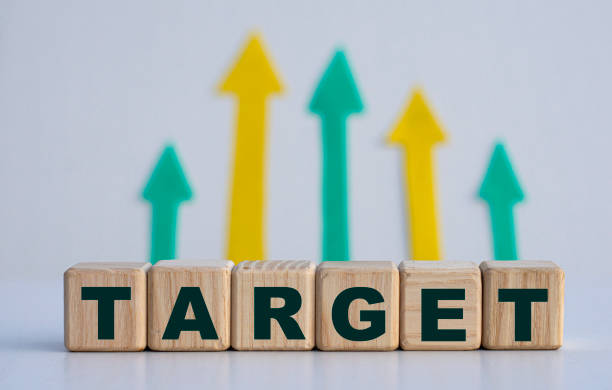 istock TARGET - word on wooden cubes on a light background with arrows up 1280027312