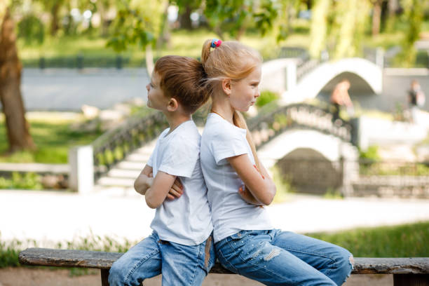 istock Children take offense at each other in the park on a bench. 1280027612