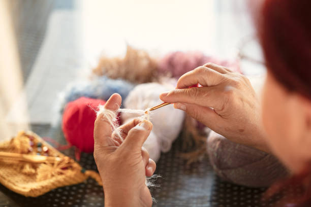 istock Close up of knitting woman's hands 1280027727