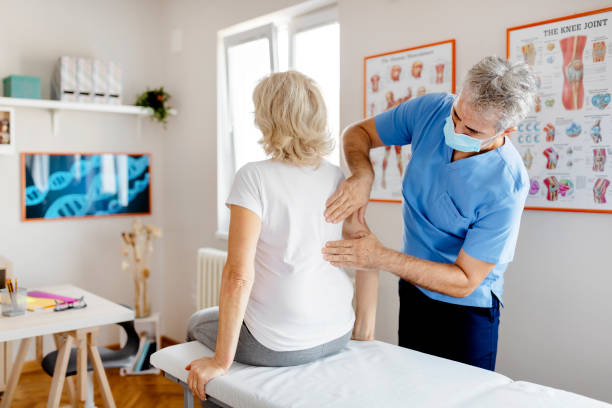 Pain is often the result of poor posture Senior Woman Having Chiropractic Back Adjustment. Osteopathy, Alternative Medicine, Pain Relief Concept. Physiotherapy, Injury Rehabilitation chiropractic adjustment photos stock pictures, royalty-free photos & images