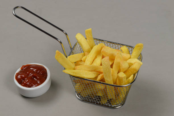 istock portion of potato chips in a metal basket. 1280027761