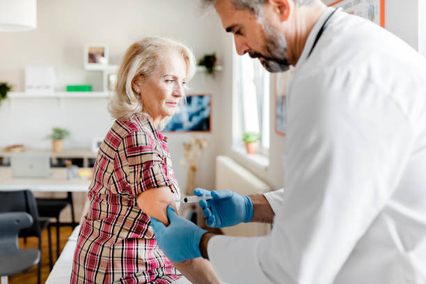 istock Woman having Vaccine Injection 1280028568