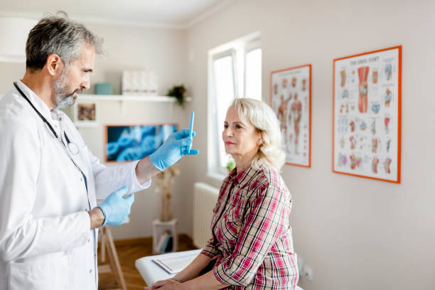 istock Doctor Doing an Eye Exam on His Senior Patient 1280028606