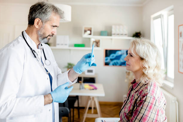 istock Doctor Doing an Eye Exam on His Senior Patient 1280028610