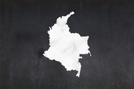 Blackboard with a the map of Colombia drawn in the middle.
