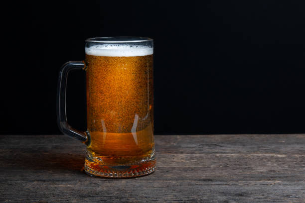 istock Glass of beer on a black background. Beer with copy space. 1280032056