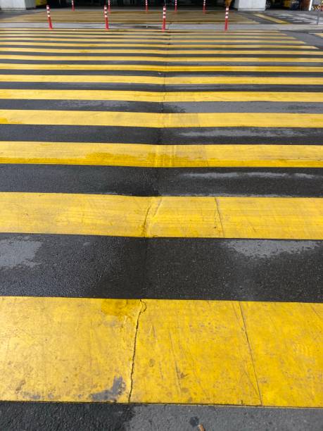 istock yellow crosswalk in rainy day 1280034519