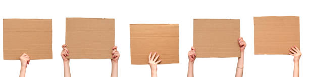 istock Posters of cardboard in his hands. Isolated on white. Set. Copy space. 1280035513