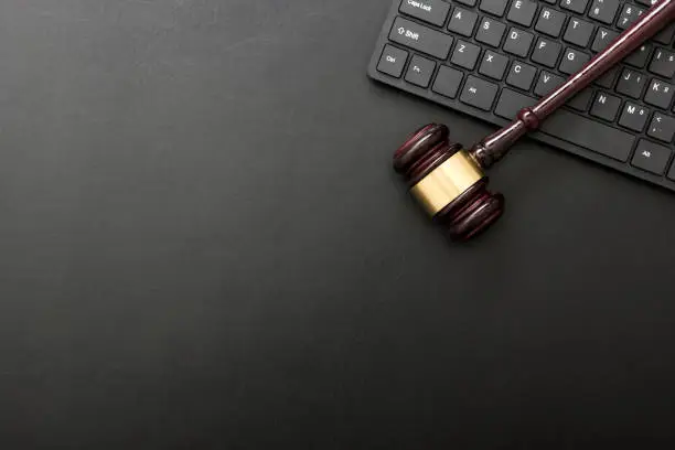 Judge gavel with computer keyboard. Concept of internet crime. Copy space for text.