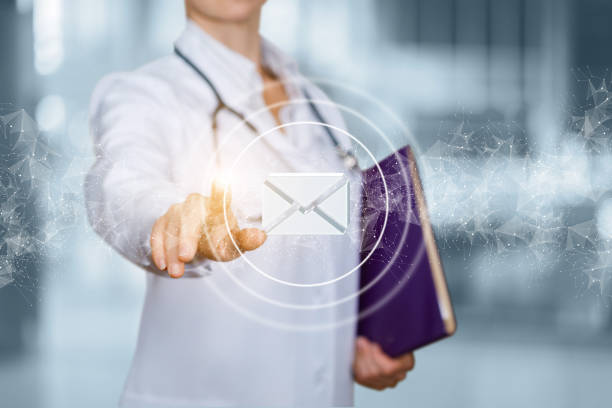 istock Doctor clicks on an email icon. 1280035866
