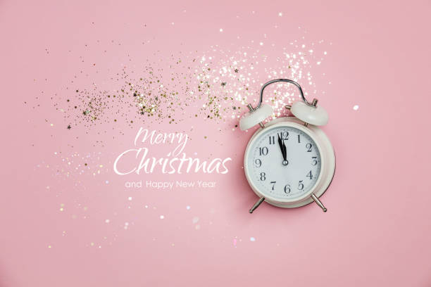 istock Creative composition with alarm clock and golden stars confetti on pink background 1280036162