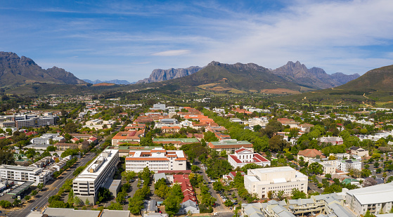 High angle view over Stellenbosch Town towards the mountains. Stellenbosch town in the western cape early spring