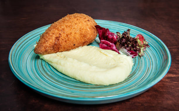 istock Traditional Kiev cutlet with mashed potatoes and salad 1280038218
