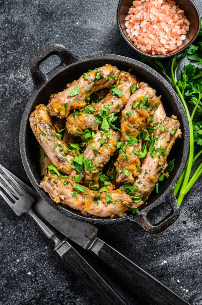 istock Stew with Chicken Neck meat and vegetables. Black background. Top view 1280039454