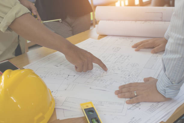 istock Engineering team consulting and analyzing the high-rise building projects in the city.Home Project to Offer Management 1280039768