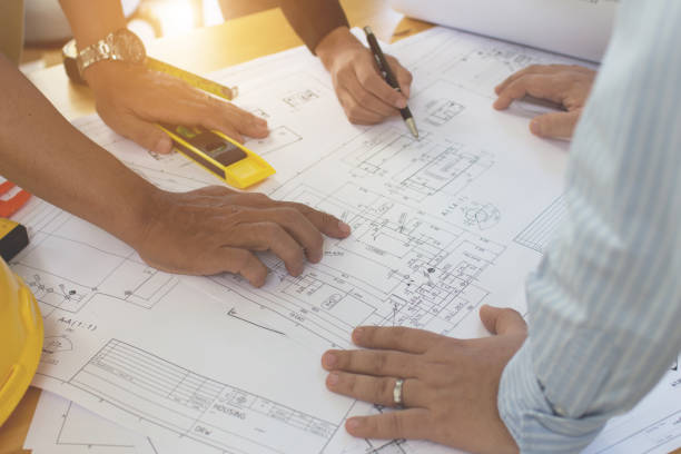 istock Engineering team consulting and analyzing the high-rise building projects in the city.Home Project to Offer Management 1280039808