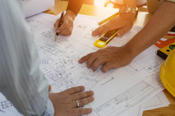 istock Engineering team consulting and analyzing the high-rise building projects in the city.Home Project to Offer Management 1280039815