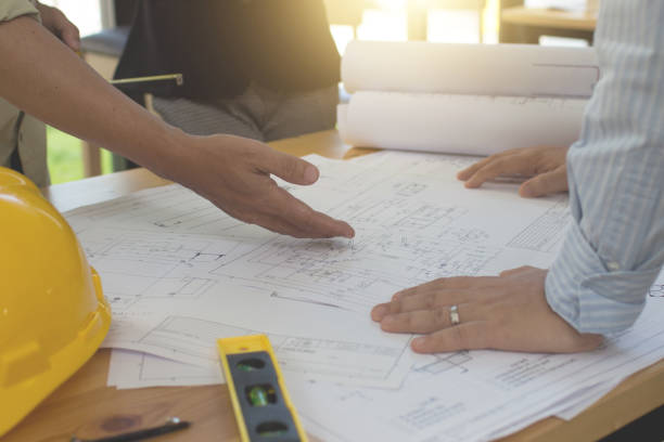 istock Engineering team consulting and analyzing the high-rise building projects in the city.Home Project to Offer Management 1280039844