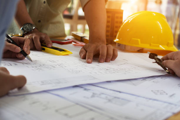 istock Engineering team consulting and analyzing the high-rise building projects in the city.Home Project to Offer Management 1280039845