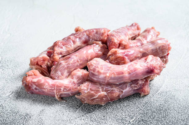 istock Raw fresh chicken neck meat. Gray background. Top view 1280039873