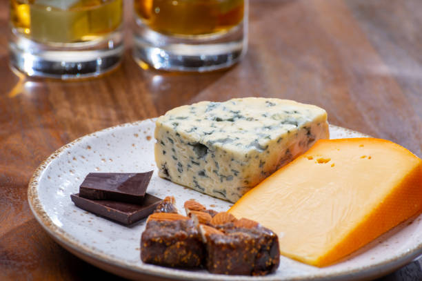 istock Tasting and pairing of different cheeses with strong alcoholic drinks, whisky, cognac or calvados 1280040101