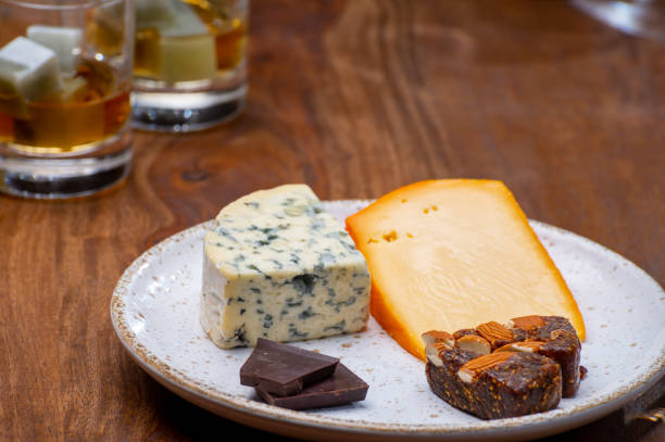 istock Tasting and pairing of different cheeses with strong alcoholic drinks, whisky, cognac or calvados 1280040109