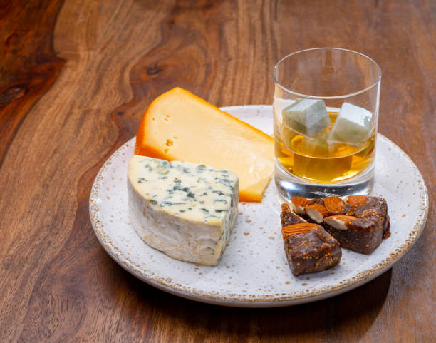 istock Tasting and pairing of different cheeses with strong alcoholic drinks, whisky, cognac or calvados 1280040124