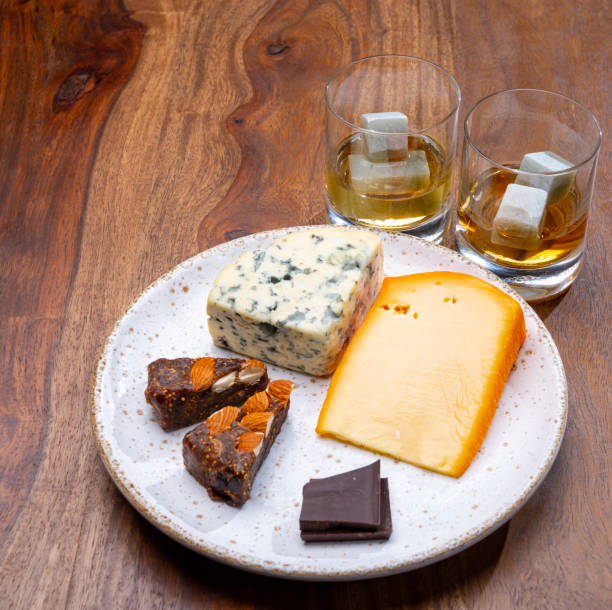 istock Tasting and pairing of different cheeses with strong alcoholic drinks, whisky, cognac or calvados 1280040128