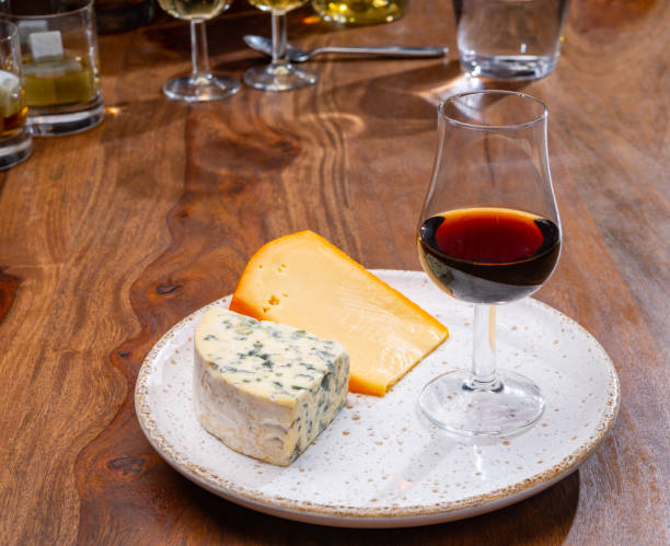 istock Tasting and pairing of different cheeses with strong alcoholic drinks, whisky, cognac or calvados 1280040129