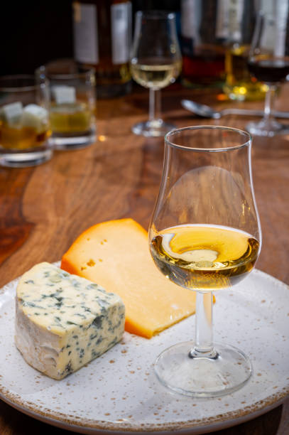 istock Tasting and pairing of different cheeses with strong alcoholic drinks, whisky, cognac or calvados 1280040155