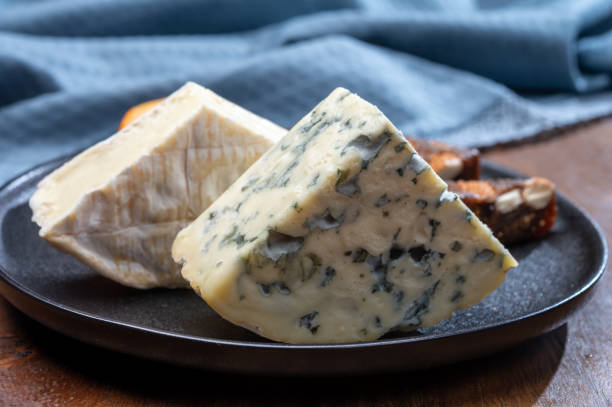 istock Cheese collection, blue cheese, camembert, brie served as dessert with fig almonds bread 1280040159