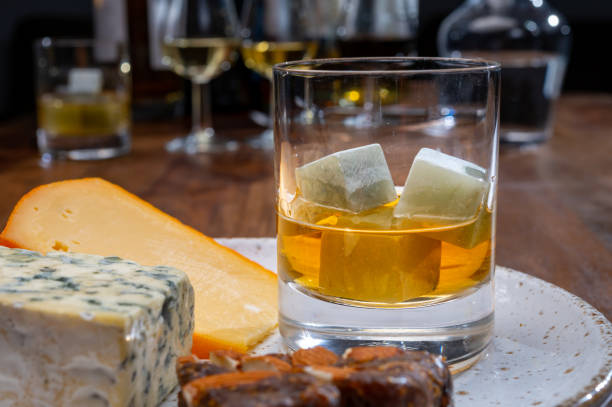 istock Tasting and pairing of different cheeses with strong alcoholic drinks, whisky, cognac or calvados 1280040205