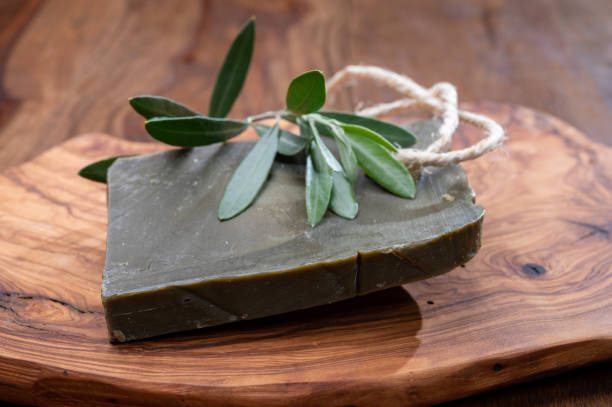 Block of handmade bio vegetal natural olives and bay leaf soap Green block of handmade bio vegetal natural olives and bay leaf soap from Provence, France savon stock pictures, royalty-free photos & images