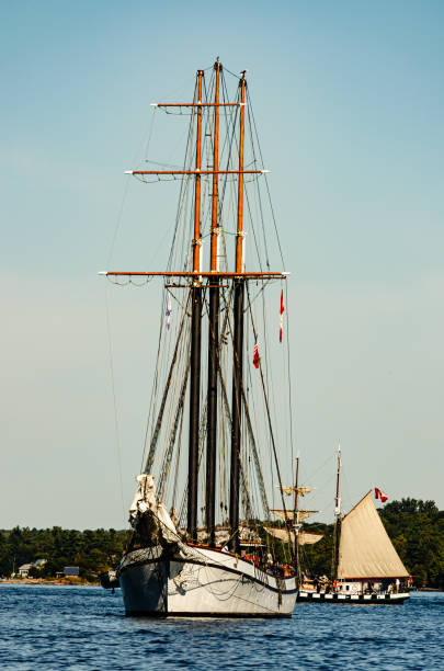 istock Vertical frame of two tall ships, one in full sail on the St. Lawrence River 1280044607