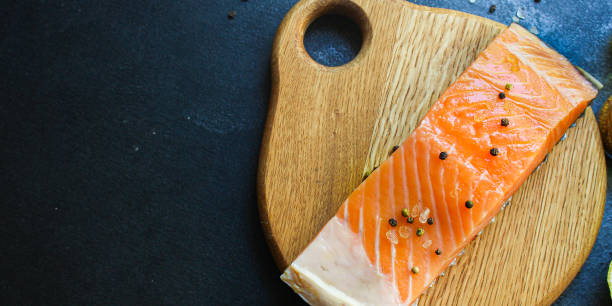 istock raw salmon fish seafood fresh dish and ingredients on the table top view copy space for text food background rustic keto or paleo diet pescetarian 1280045755