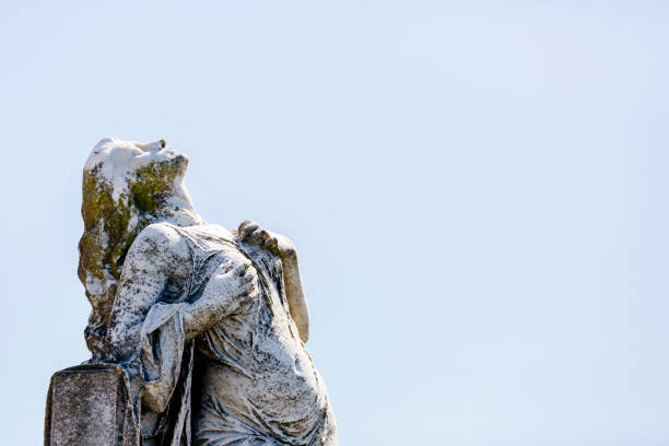 istock Old statue of grieving young woman, background with copy space 1280047184