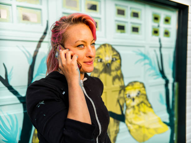 istock Female mural artist at work 1280048313