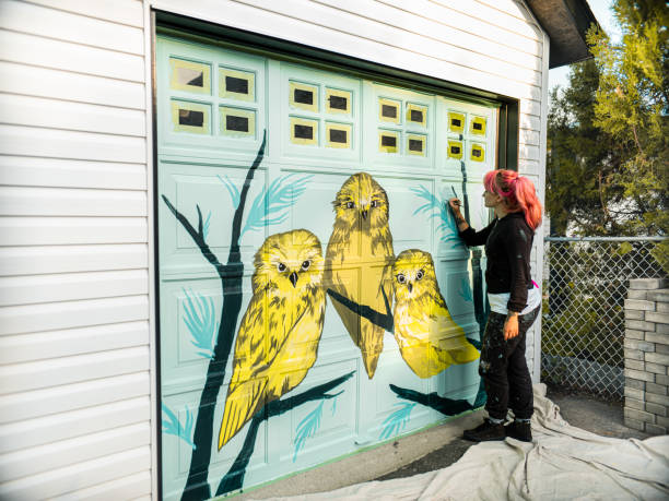 istock Female mural artist at work 1280048369
