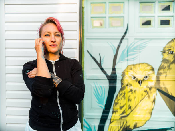 istock Female mural artist at work 1280048381