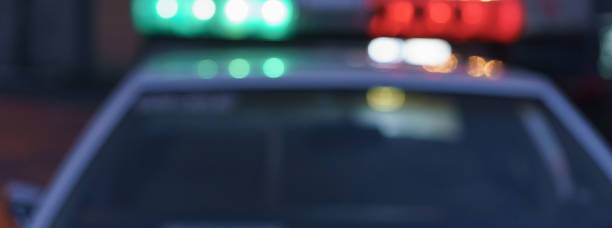 istock Police car in night city 1280048541