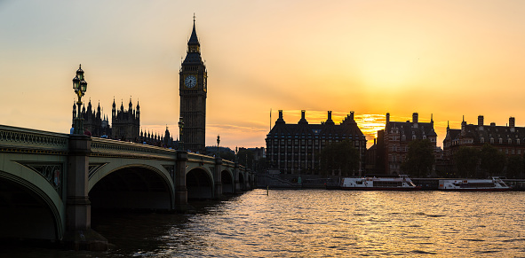 The Big Ben, the Houses of Parliament and Westminster bridge in London in a beautiful summer night, England, United Kingdom