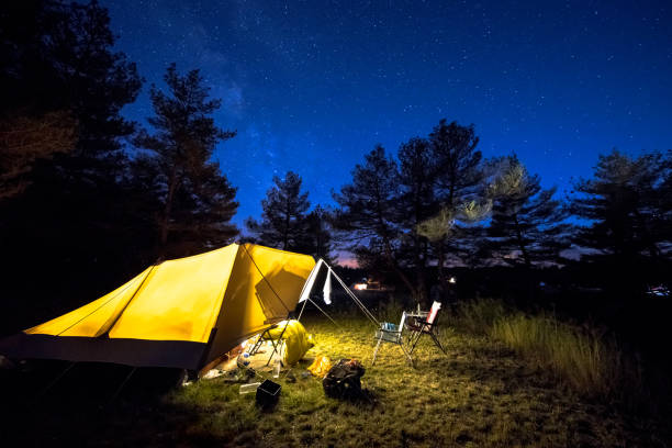 istock Family tent on camping ground under stars 1280049979