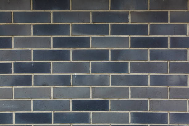 istock dark brick wall, the gray block as a background texture 1280050073