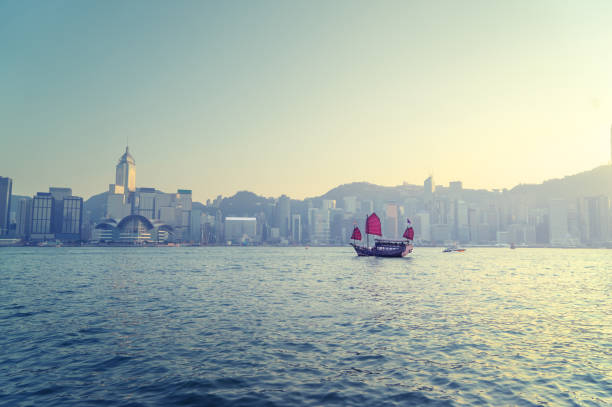 istock Hong Kong harbour in sunset time 1280053392